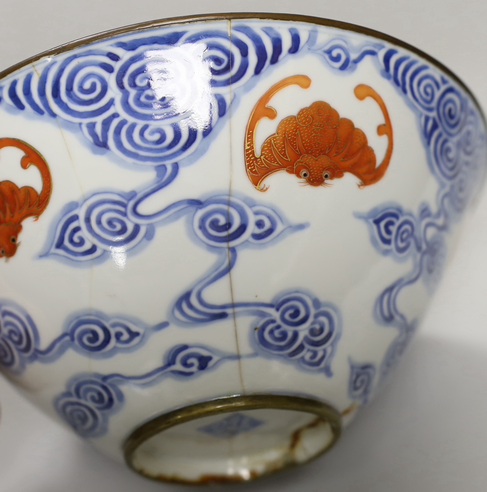 A 19th century Chinese blue and white bowl with iron-red bats, 23cm diam.